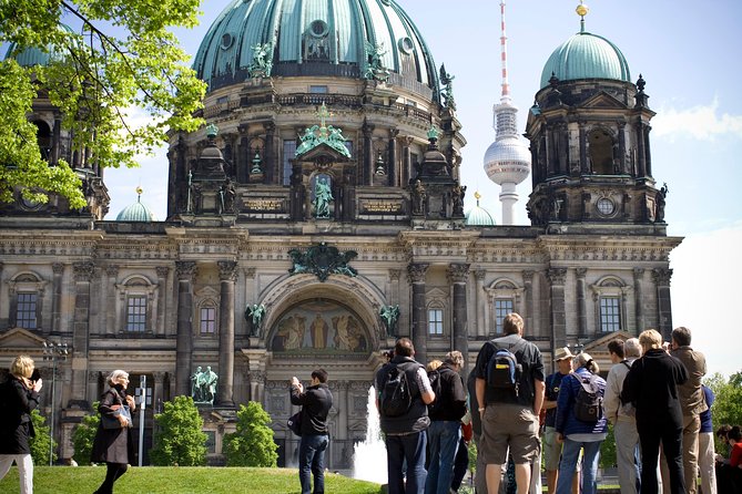 Explore Berlin Shore Excursion: Top Attractions Private Tour from Warnemuende - Checkpoint Charlie explains the Cold War divide